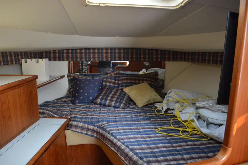 Slide: The Image of 1999 Pursuit 3400 Express boat interior control panel with wooden accents. - 31