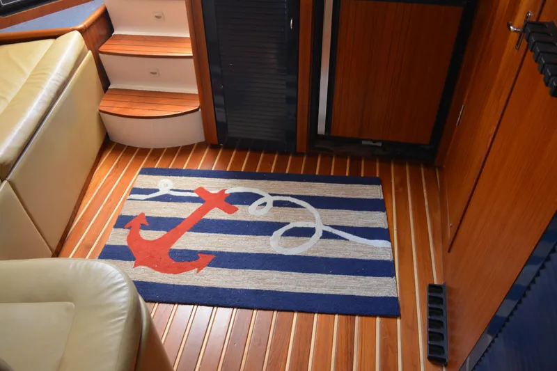 Slide: The Image of Beige leather seating in 1999 Pursuit 3400 Express boat interior. - 32