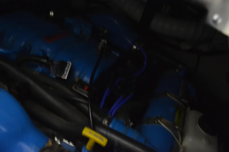 Slide: The Image of Interior cabin of 1999 Pursuit 3400 Express with bed and mounted TV. - 38