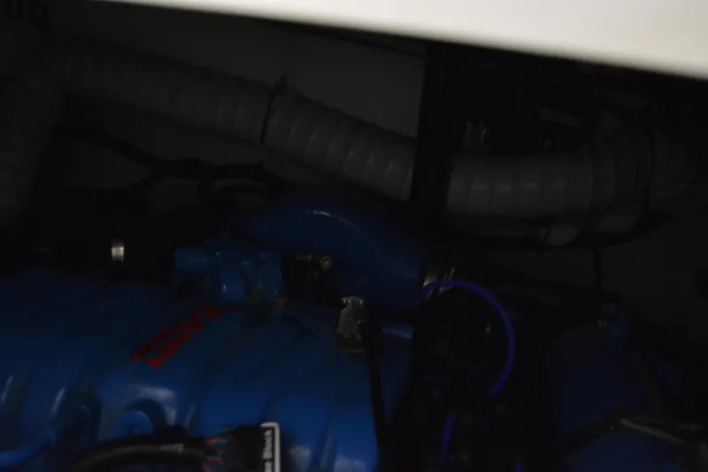 Slide: The Image of Cozy cabin bed in 1999 Pursuit 3400 Express boat with plaid bedding. - 42