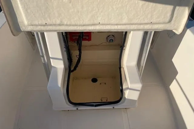 Slide: The Image of 2005 KenCraft 206 boat interior compartment with wiring and storage space. - 10