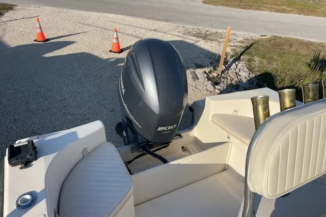 Slide: The Image of 2005 KenCraft 206 boat with Yamaha 200 outboard motor, parked on gravel. - 12