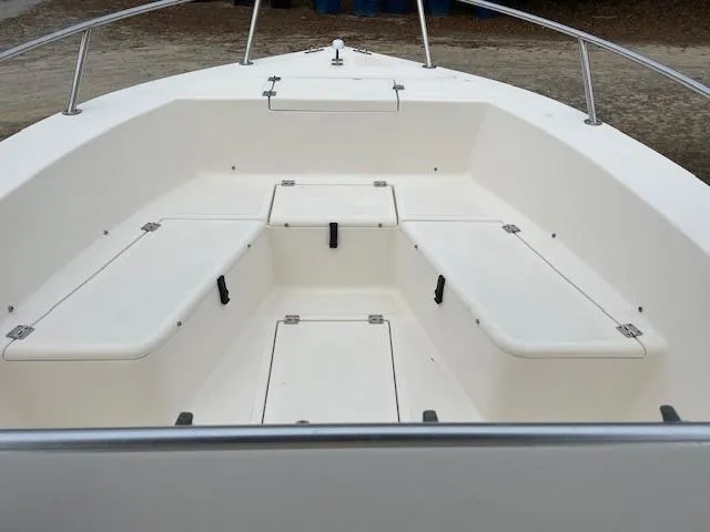 Slide: The Image of 2005 KenCraft 206 boat interior with white cushioned seating and steering wheel. - 5