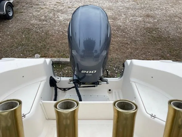 Slide: The Image of 2005 KenCraft 206 boat interior with white cushioned seating and metal frame. - 6