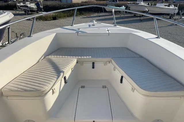 Slide: The Image of 2005 KenCraft 206 boat interior with cushioned seating and storage compartments. - 7