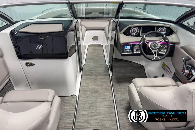 Slide: The Image of Interior of 2025 Four Winns HD3 boat, featuring modern dashboard and seating. - 15