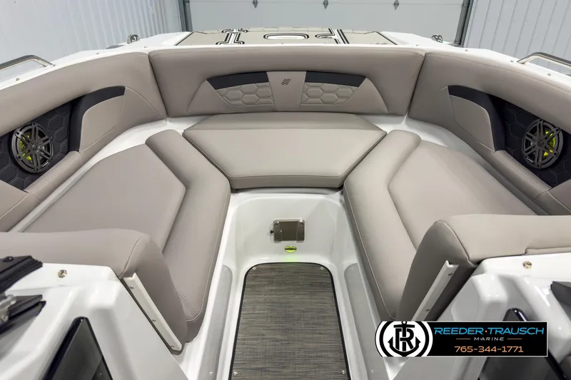 Slide: The Image of 2025 Four Winns HD3 boat interior with gray seating and speakers, Reeder-Trausch Marine logo visible. - 16
