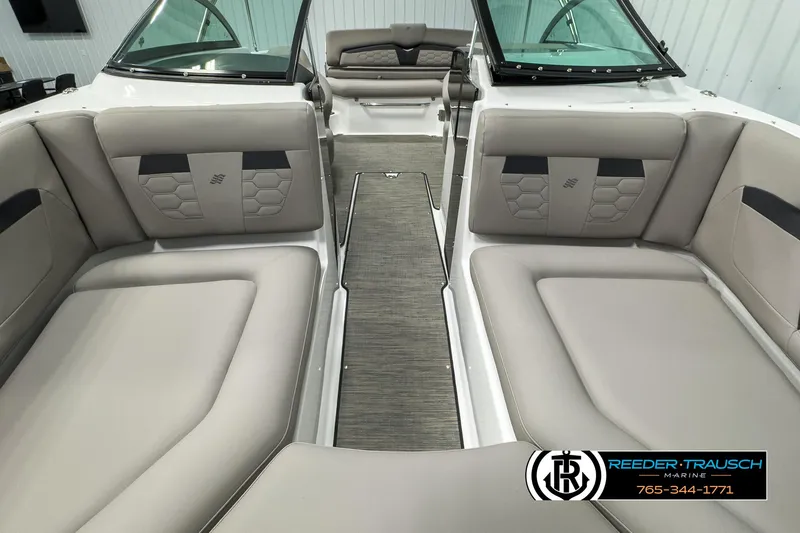 Slide: The Image of 2025 Four Winns HD3 boat interior with beige seating and modern design. - 17