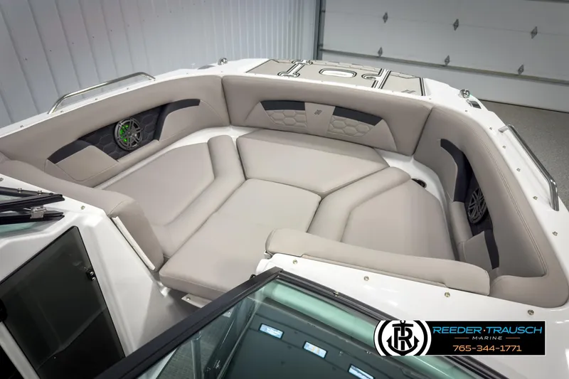 Slide: The Image of 2025 Four Winns HD3 boat interior with beige seating and speaker system. - 21
