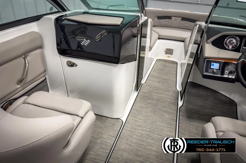 Slide: The Image of Interior of 2025 Four Winns HD3 boat with modern seating and dashboard. - 27