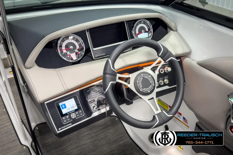 Slide: The Image of 2025 Four Winns HD3 boat dashboard with steering wheel and control panel. - 30