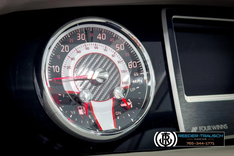 Slide: The Image of Dashboard of 2025 Four Winns HD3 boat with speedometer and fuel gauge. - 33