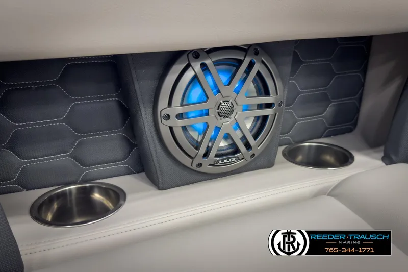 Slide: The Image of 2025 Four Winns HD3 boat interior with JL Audio speaker and cup holders. - 42