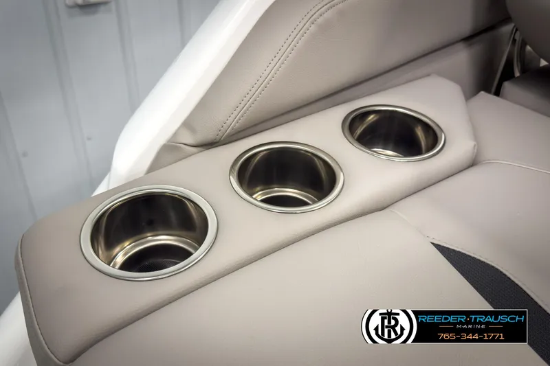 Slide: The Image of 2025 Four Winns HD3 boat interior with three stainless steel cup holders. - 44