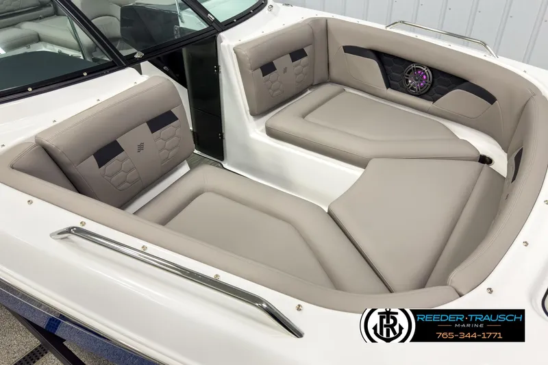 Slide: The Image of 2025 Four Winns HD3 boat interior with beige seating and speaker system. - 9