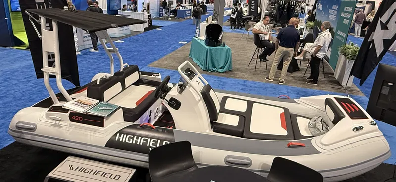 Slide: The Image of 2025 Highfield Velox 420 inflatable boat displayed at a trade show. - 6