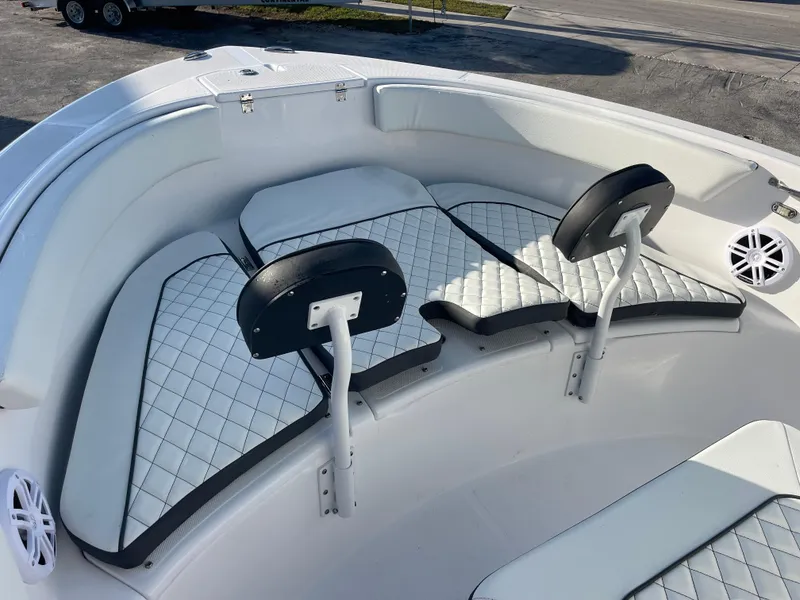 Slide: The Image of 2025 Clearwater 2200 WI Center Console boat with cushioned seating and backrests. - 12