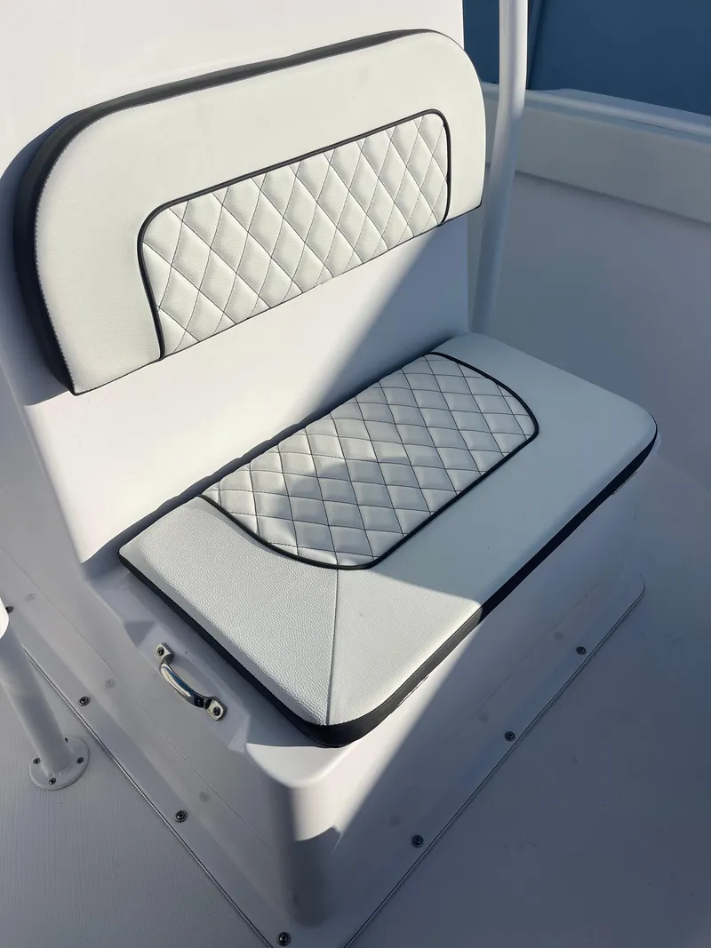 Slide: The Image of 2025 Clearwater 2200 WI Center Console boat seat with quilted white upholstery. - 15