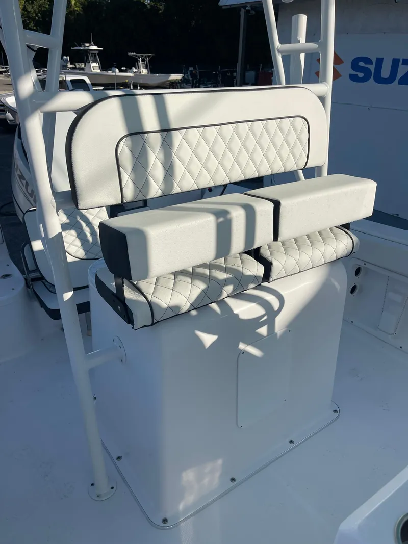 Slide: The Image of 2025 Clearwater 2200 WI Center Console boat with cushioned seating and sleek design. - 16