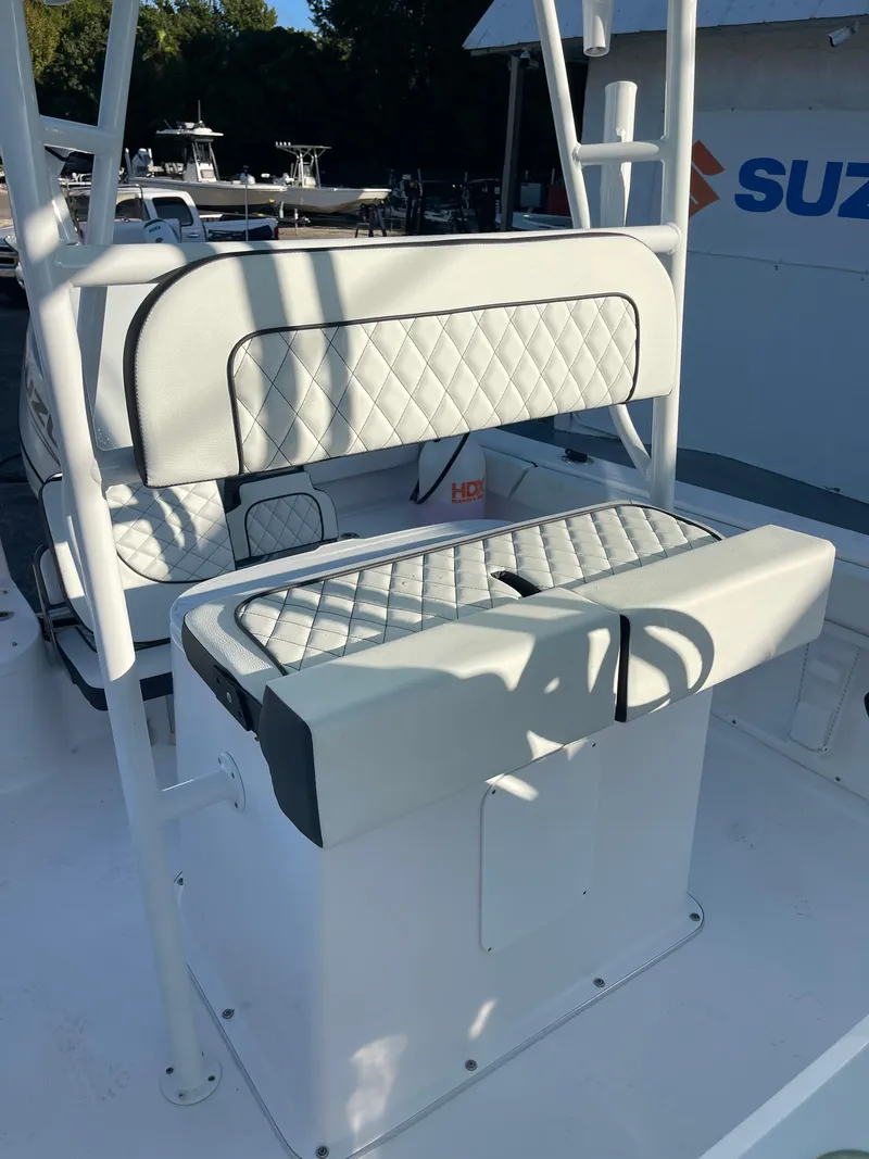 Slide: The Image of 2025 Clearwater 2200 WI Center Console boat with quilted seating and white finish. - 17