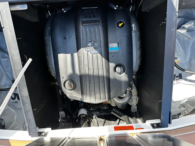 Slide: The Image of 2022 Axis A24 boat engine compartment with visible components and labels. - 11