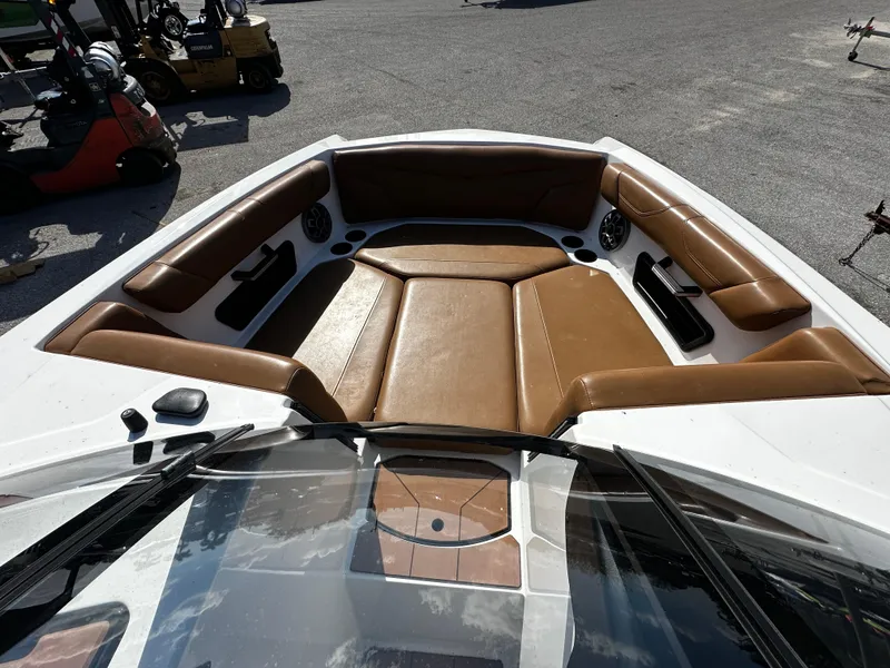 Slide: The Image of 2022 Axis A24 boat interior with brown leather seating and modern design. - 15