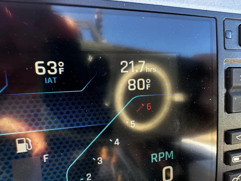 Slide: The Image of Dashboard display of a 2022 Axis A24 showing temperature and engine hours. - 21