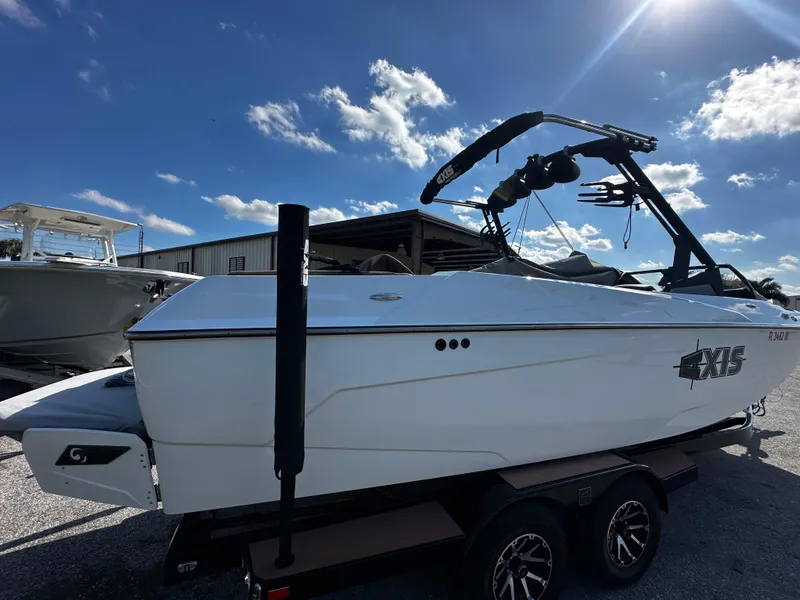 Slide: The Image of 2022 Axis A24 boat on trailer under blue sky. - 5