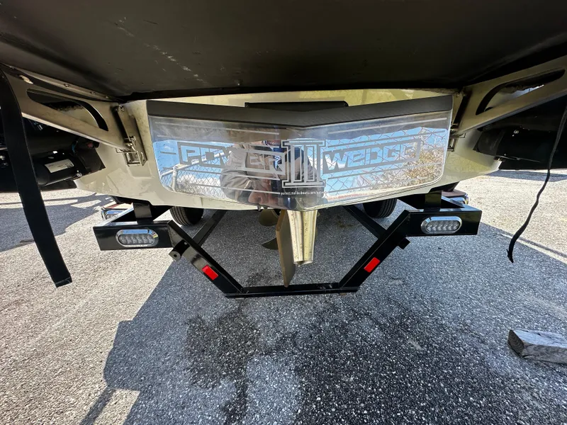 Slide: The Image of 2022 Axis A24 boat with Power Wedge III, rear view on pavement. - 8