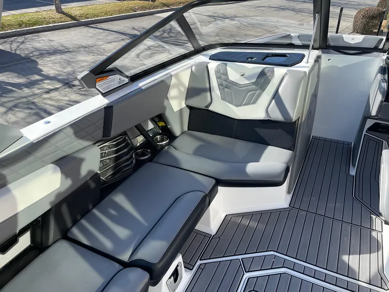Slide: The Image of 2022 Nautique Super Air Nautique G25 interior with sleek seating and modern design. - 10