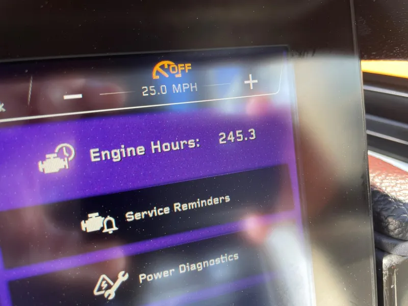 Slide: The Image of Dashboard display of 2022 Nautique Super Air Nautique G25 showing 245.3 engine hours. - 12