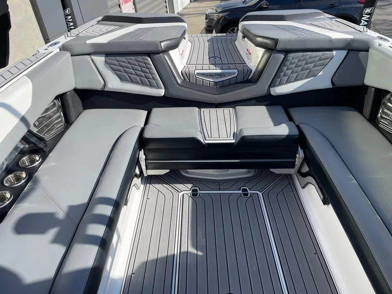Slide: The Image of 2022 Nautique Super Air Nautique G25 interior with sleek gray seating and modern design. - 8