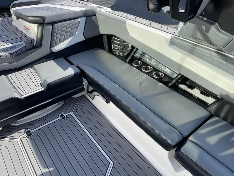 Slide: The Image of 2022 Nautique Super Air Nautique G25 interior with sleek seating and modern design. - 9