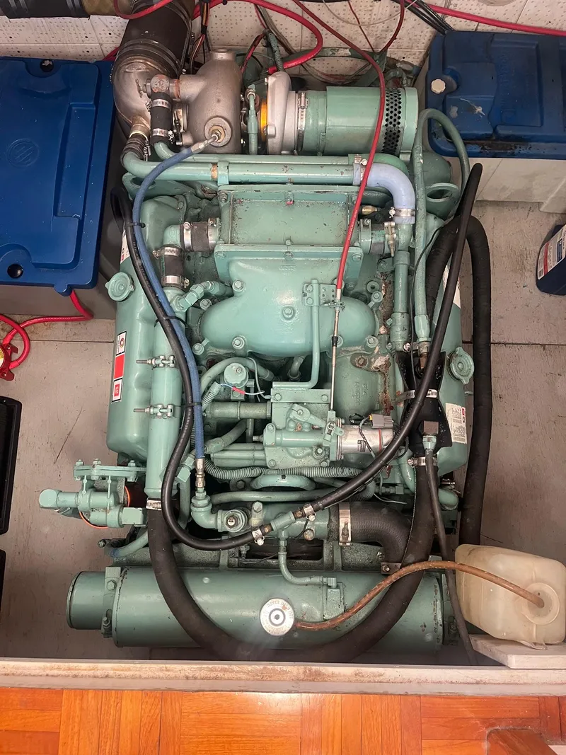 Slide: The Image of Engine compartment of a 1985 Roughwater 41 Pilothouse boat, showcasing mechanical components. - 5