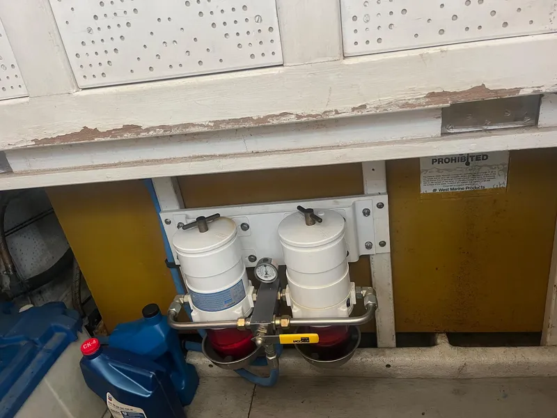 Slide: The Image of Engine room of 1985 Roughwater 41 Pilothouse with fuel filters and gauge. - 6