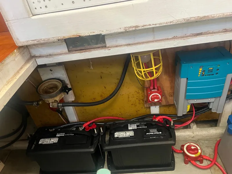 Slide: The Image of 1985 Roughwater 41 Pilothouse battery compartment with wiring and electrical components. - 7