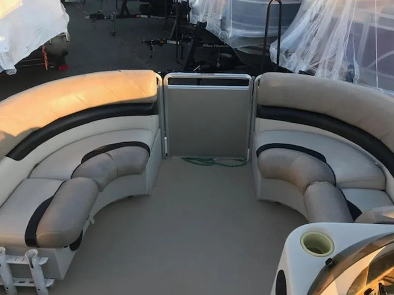 Slide: The Image of 2013 Cypress Cay Seabreeze 180 pontoon boat interior with curved seating and cup holders. - 13
