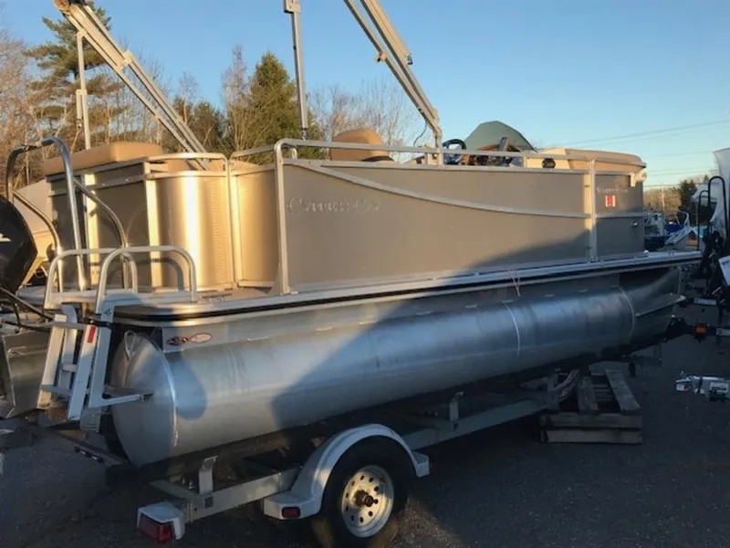 Slide: The Image of 2013 Cypress Cay Seabreeze 180 pontoon boat on trailer, parked outdoors. - 3