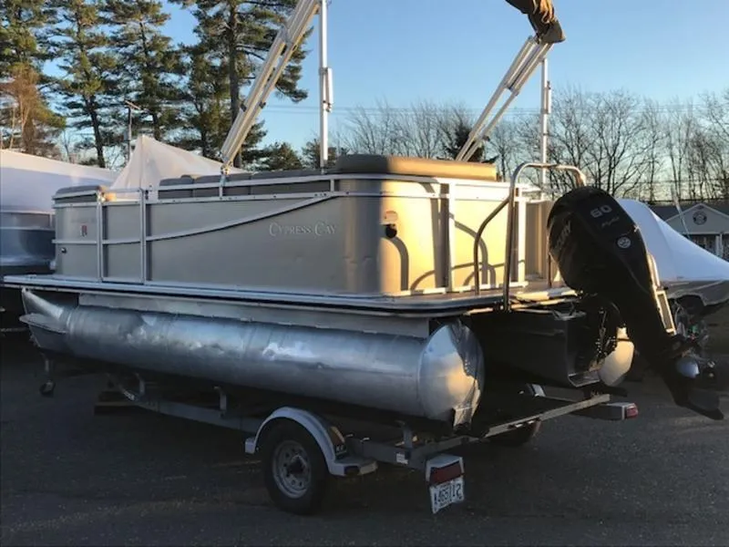 Slide: The Image of 2013 Cypress Cay Seabreeze 180 pontoon boat on trailer, parked outdoors. - 4