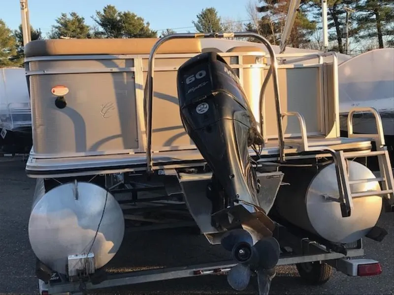 Slide: The Image of 2013 Cypress Cay Seabreeze 180 pontoon boat with outboard motor on trailer. - 6