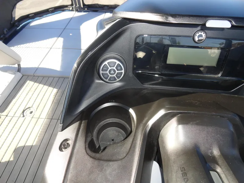 Slide: The Image of 2024 Sea-Doo Switch Sport 18 dashboard with control panel and cup holder. - 12