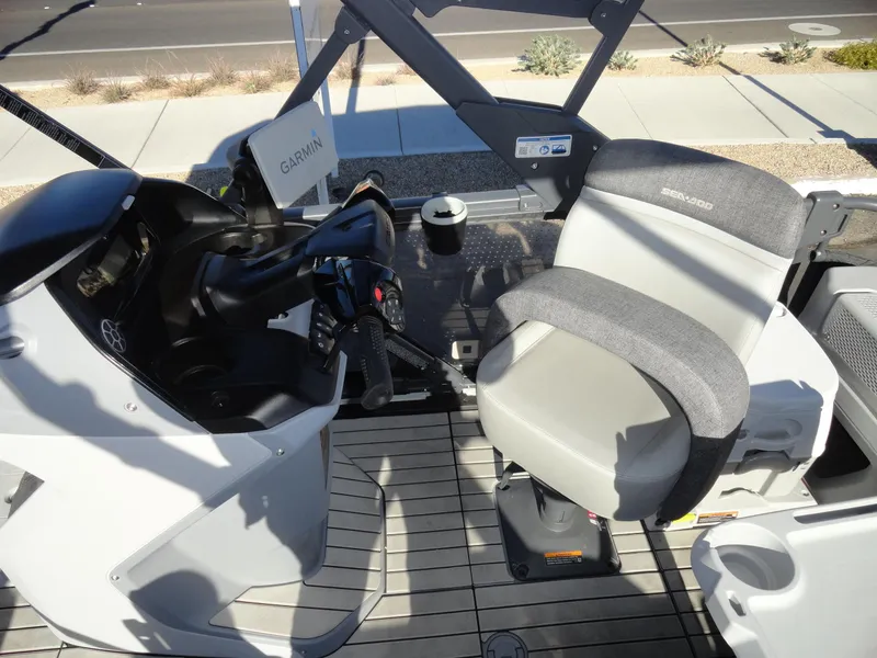 Slide: The Image of 2024 Sea-Doo Switch Sport 18 interior with steering console and seating. - 14