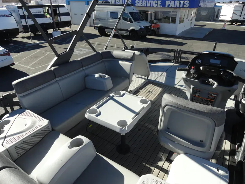 Slide: The Image of 2024 Sea-Doo Switch Sport 18 - 230 HP interior with seating and control panel. - 16