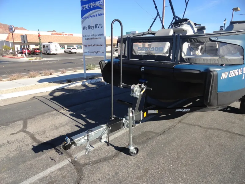 Slide: The Image of 2024 Sea-Doo Switch Sport 18 - 230 HP on trailer in parking lot. - 24