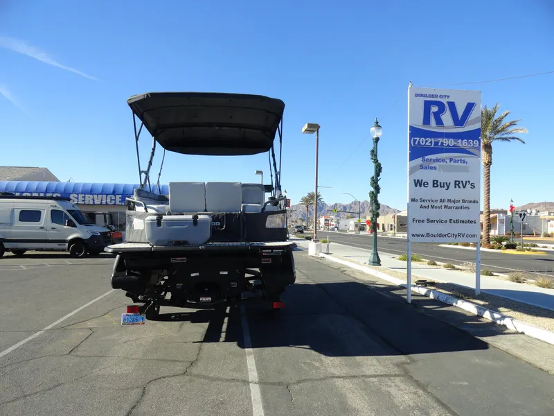 Slide: The Image of 2024 Sea-Doo Switch Sport 18 - 230 HP parked near RV dealership. - 25