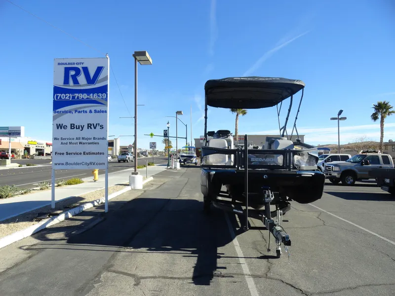 Slide: The Image of 2024 Sea-Doo Switch Sport 18 - 230 HP parked near RV dealership. - 3