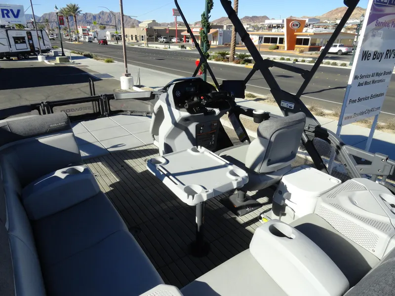 Slide: The Image of 2024 Sea-Doo Switch Sport 18 - 230 HP interior with seating and steering console. - 7