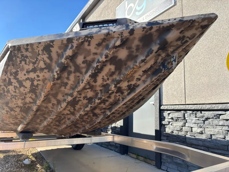 Slide: The Image of 2025 Edge Duck Boats 756DB with camouflage design on a trailer. - 12