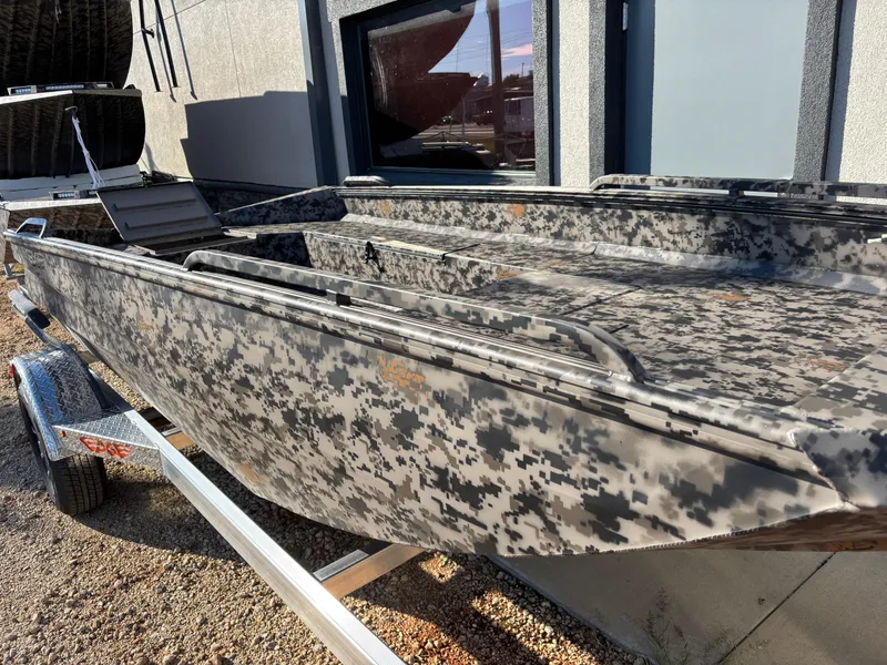 Slide: The Image of 2025 Edge Duck Boats 756DB with camouflage design on a trailer. - 13