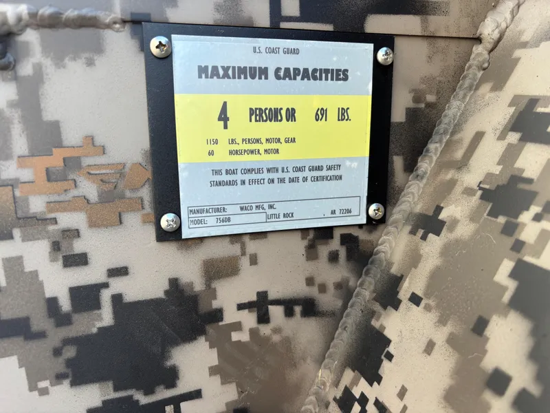 Slide: The Image of 2025 Edge Duck Boats 756DB capacity plate, camo design, 4 persons or 691 lbs limit. - 16